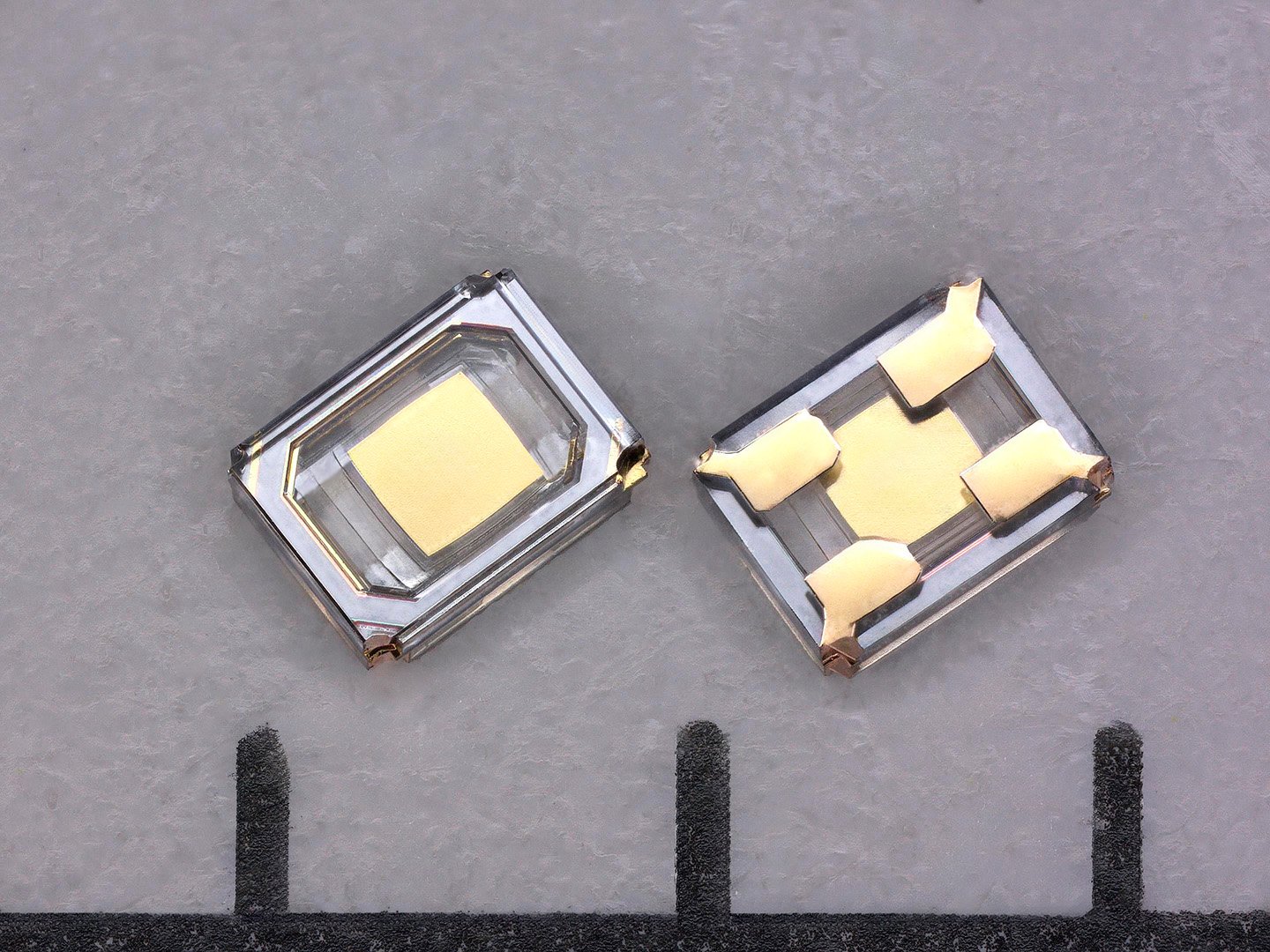 Product photo of the world's first 0806-size (0.8 x 0.6 mm) AT-cut crystal unit developed by River Eletec, the world's No.1 provider of miniature crystal units.